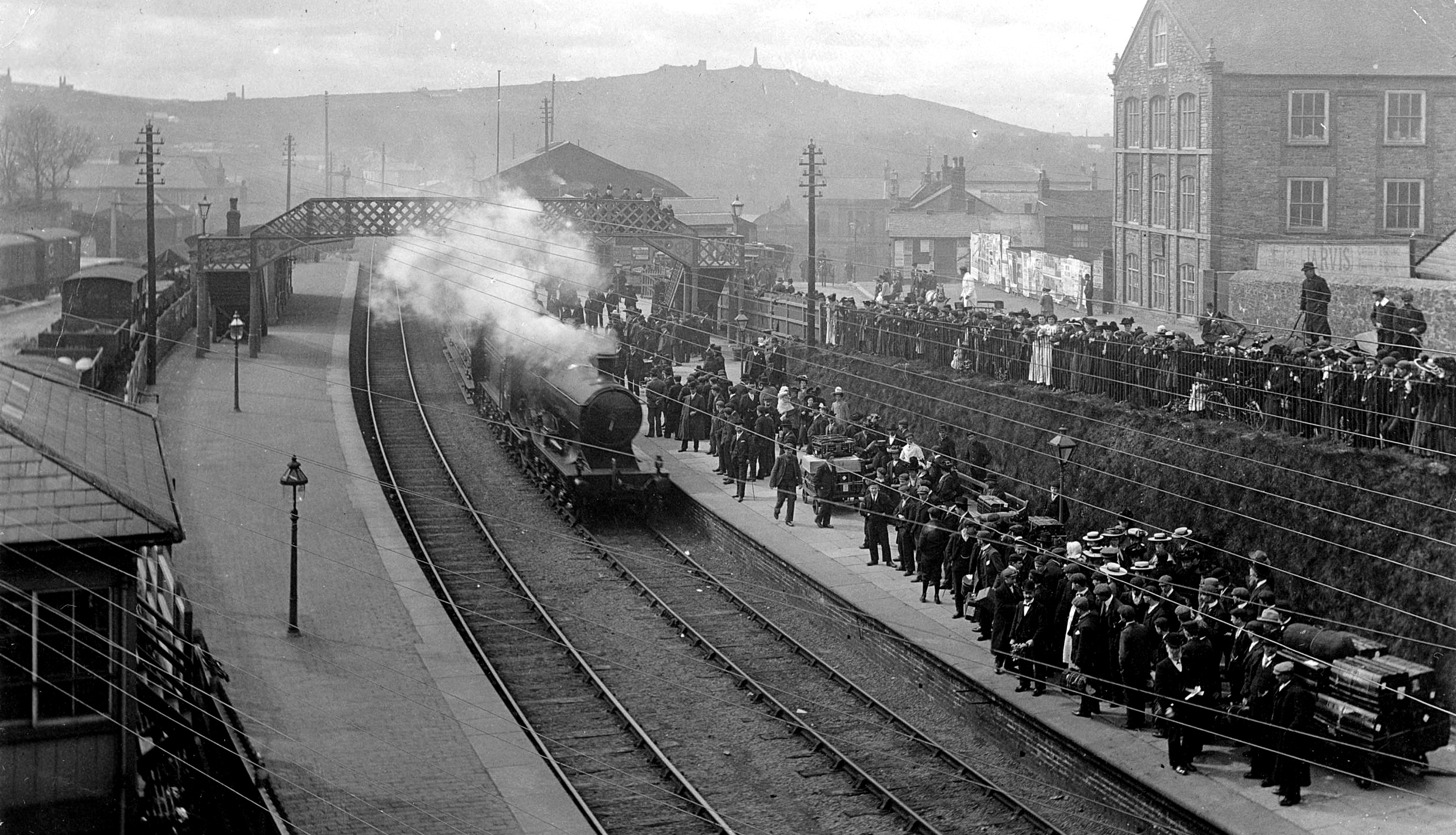 Photo of Redruth station, Cornwall late C19th. Showing miners departing for South Africa